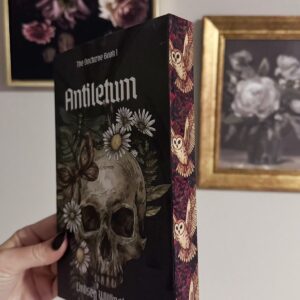 A hand signed standard edition paper back copy of Antiletum by Lindsey Willingham with sublimated edges.