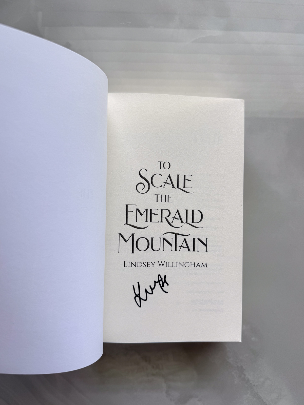 to scale the emerald mountain signed.